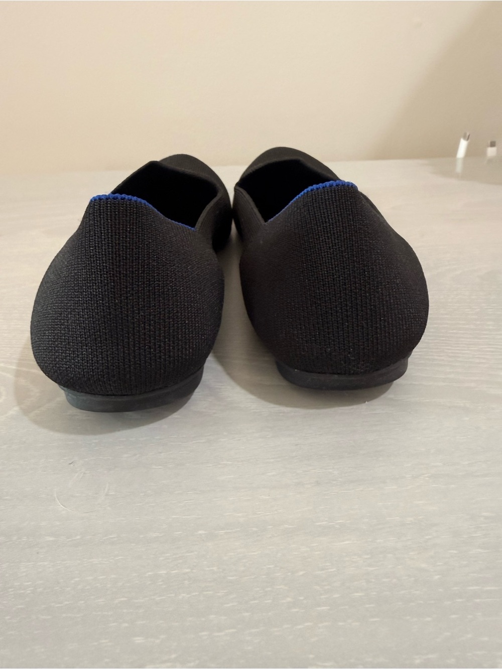 Rothy's Black Slip-On Flats with Blue Trim - Picture 2 of 8